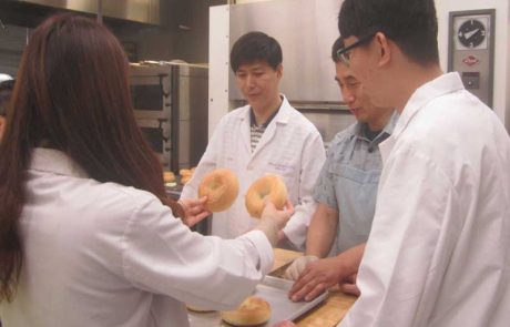 Team evaluating bagels